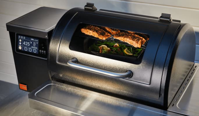 Food visible through the A Vida by PADERNO Wi-Fi & Bluetooth Pellet Grill