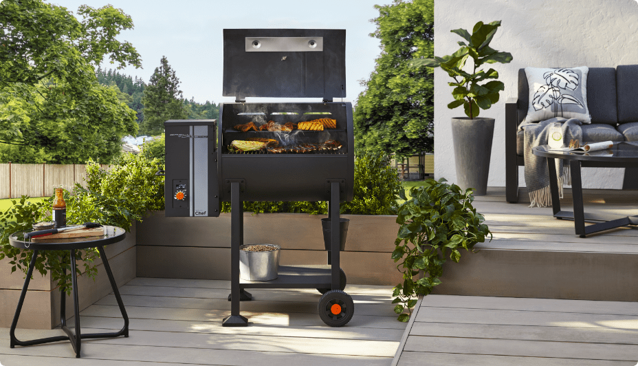 Food grilling on a MASTER Chef Grill Turismo Pellet Grill & Smoker on a patio.