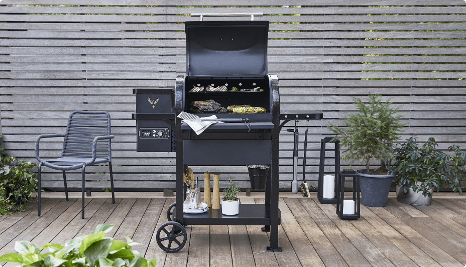 Vermont Castings Woodland Pellet Grill on a wooden patio.