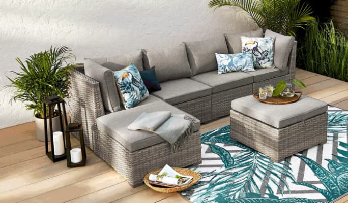 CANVAS Bala Conversation Set with sectional and ottoman on a patio. 