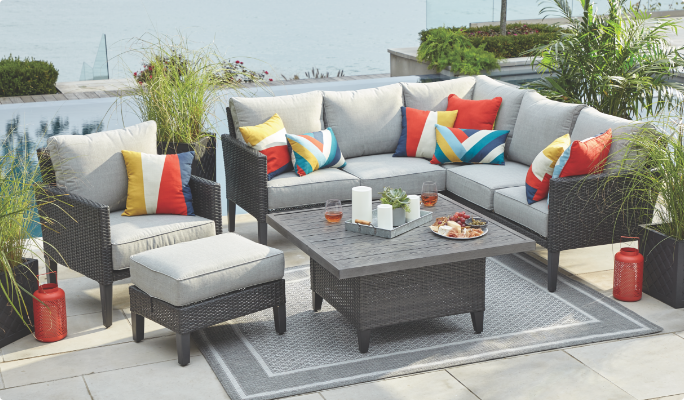 CANVAS Renfrew Sectional Set on lakeview patio with coffee table. 