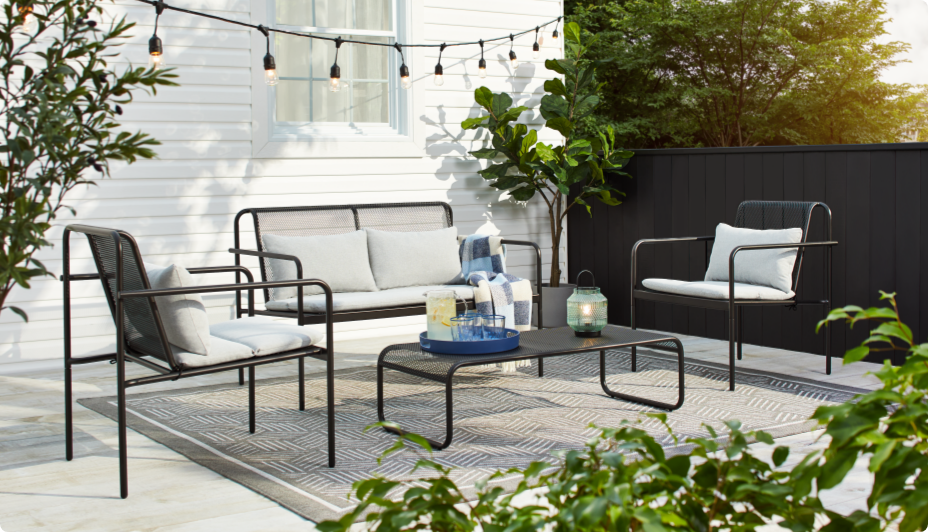 CANVAS Meridian Collection sofa, armchairs and coffee table on a patio.