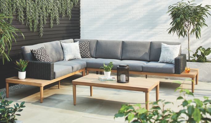 CANVAS Edenvale Collection sofa, coffee table and armchairs arranged on a patio.
