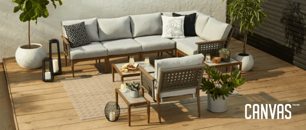 A 9-pc CANVAS Baffin Conversation Set on a patio with decor and potted plants. 