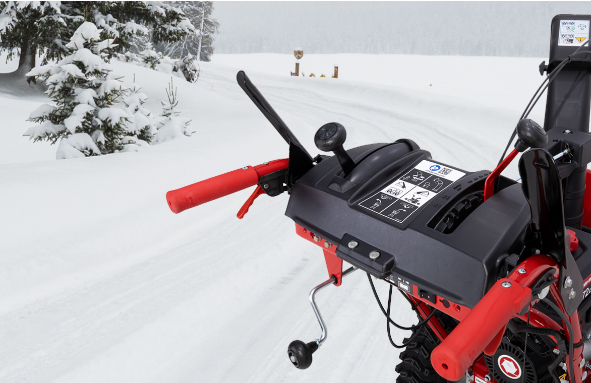 Self-propelled snow blower outdoors.