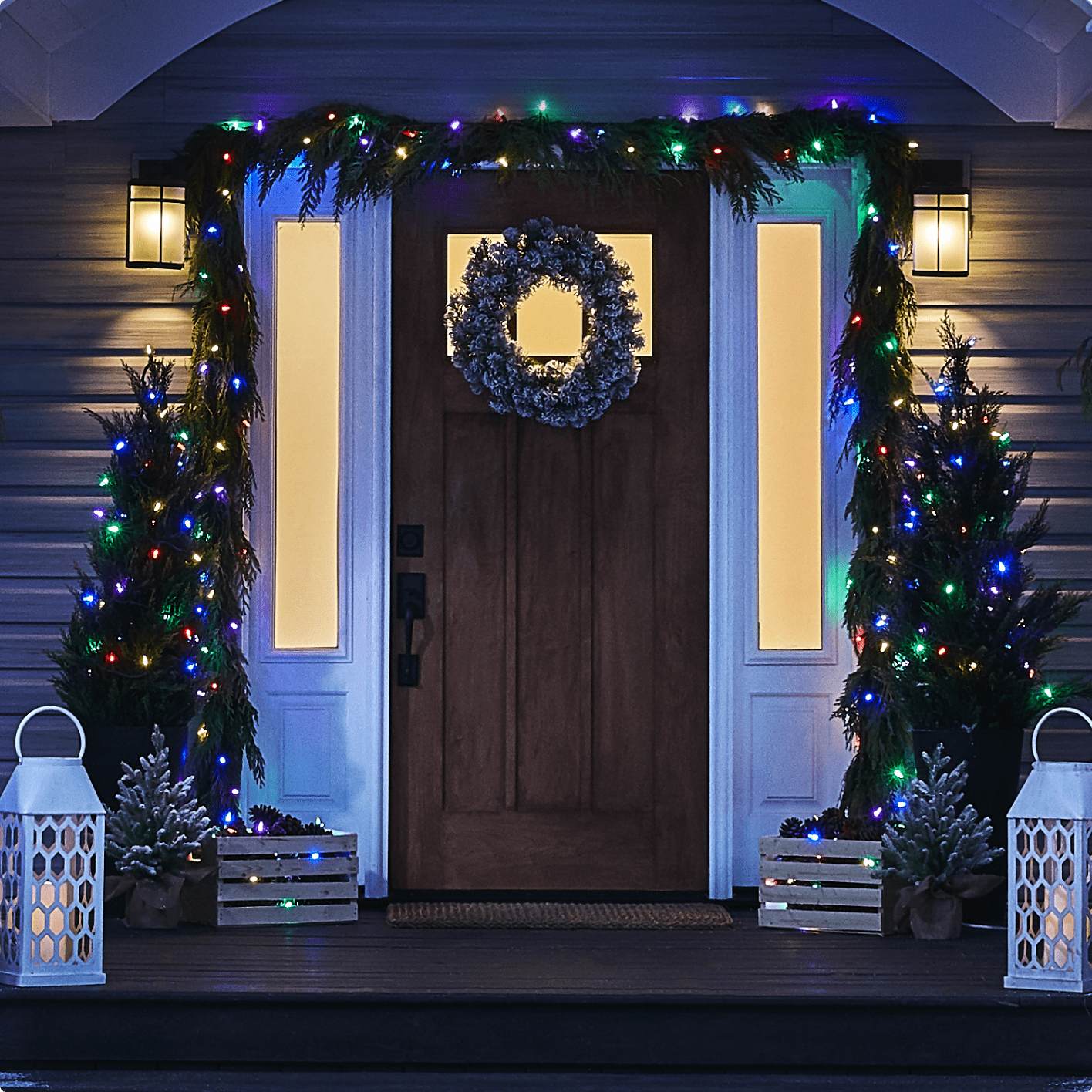 Front door of a home decorated with NOMA Advanced Lightshow 50 LED colour-changing Christmas lights
