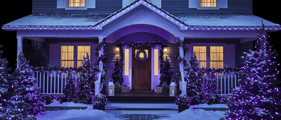 Front of a home decorated with NOMA Constant-Lit LED colour-changing Christmas lights