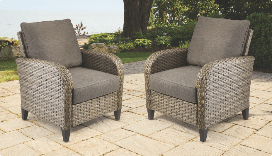 A pair of Breton armchairs with brown CANVAS Breton Replacement Cushions.