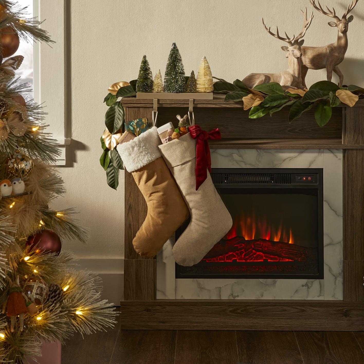 CANVAS Winter Garden stockings hanging on fireplace.