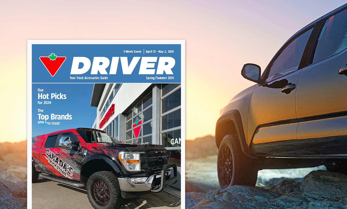 Cover image of the 2024 Driver Guide. A truck in a rugged landscape at dusk.