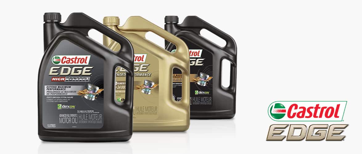  Three 5-litre jugs of Castrol Edge synthetic oil of varying grades.