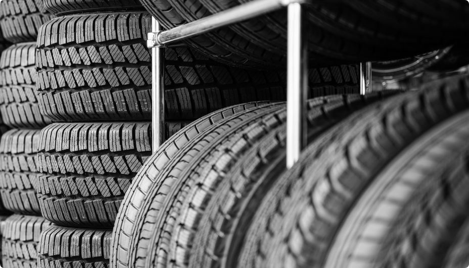 Tires stacked on a rack.