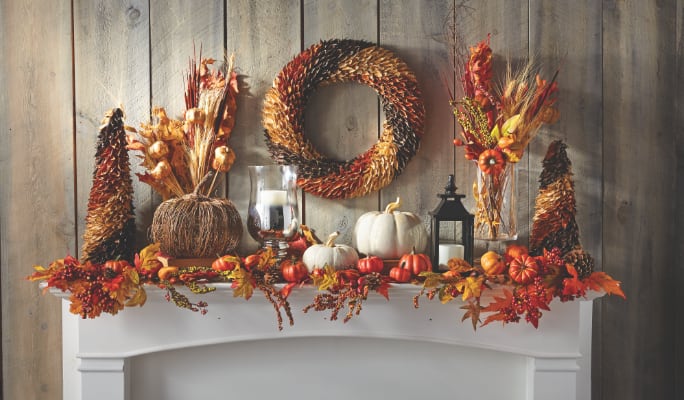 Harvest-themed decor on a mantel.