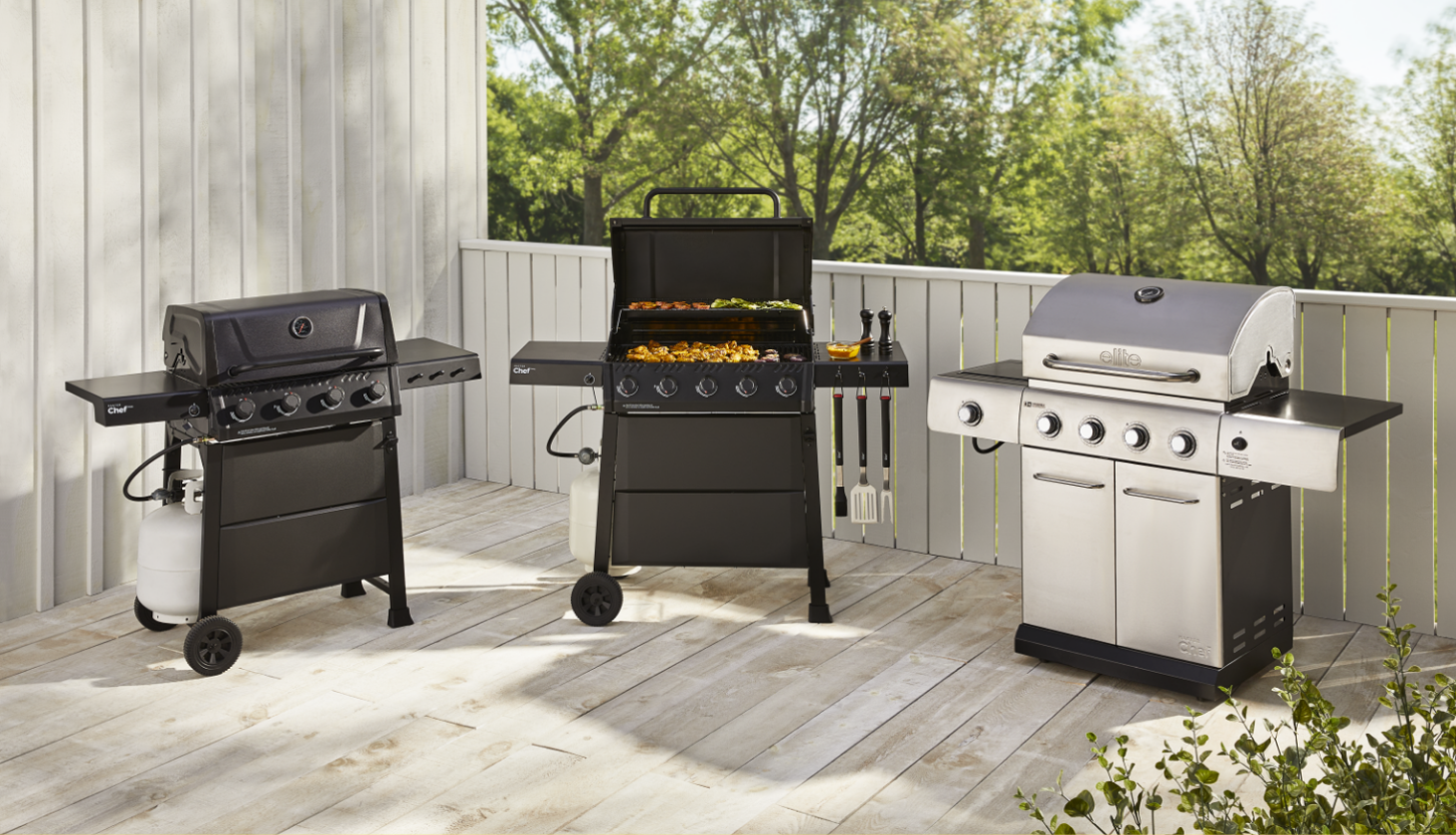 Three MASTER Chef propane BBQs side by side on a patio