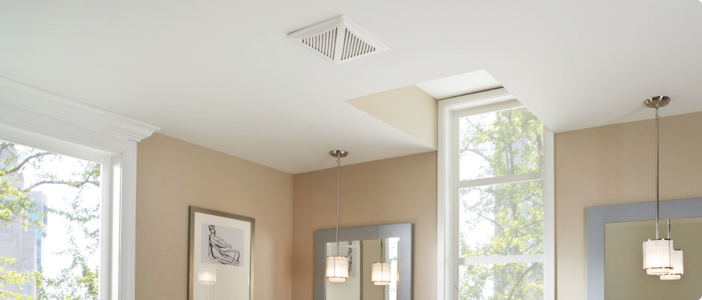 A bathroom exhaust fan installing in a ceiling. 