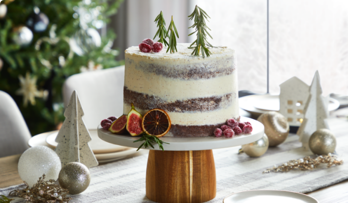 A CANVAS Cake Stand with Wooden Base on a dining table.