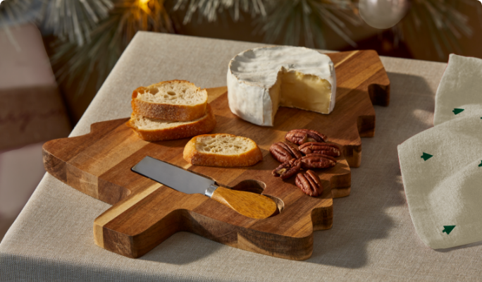 A CANVAS Acacia Wood Cheese Board and Knife Set with bread and cheese on a table.