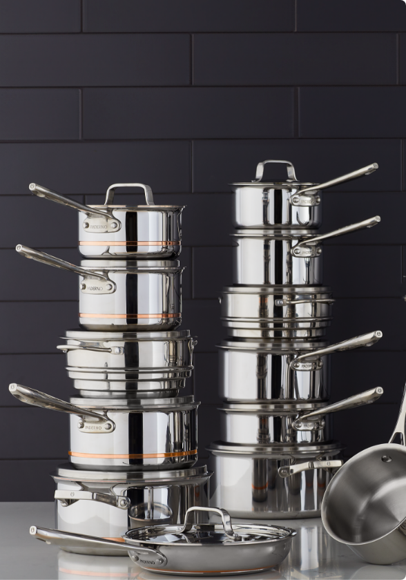 An assortment of stacked PADERNO Canadian-made cooksets, pots and pans.