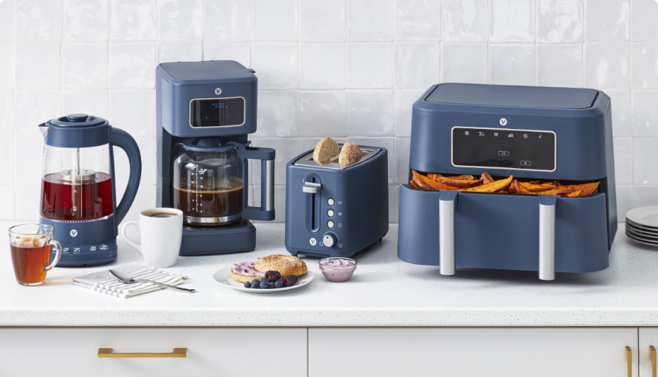  A set of various matching, blue-coloured kitchen appliances.