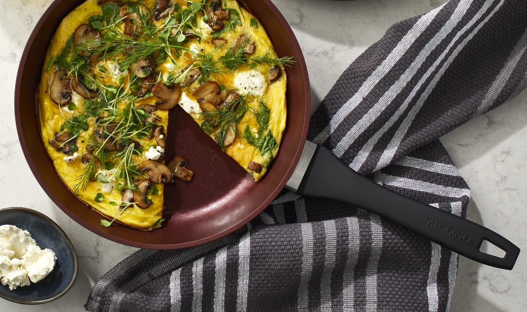 A freshly cooked quiche in a PADERNO Classic Non-stick frying pan.