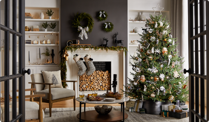 A living room with a Christmas tree and CANVAS Night Before Christmas decorations. 