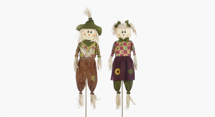 A pair of For Living Scarecrow Decorations with stakes. 