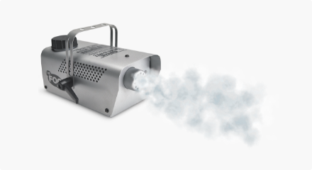 Mini Fogger machine emitting a stream of fog. 