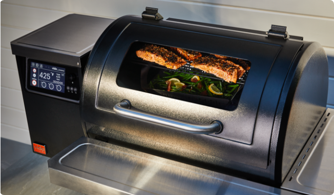 An overhead shot of the grill showing food cooking through the EasyCHECK window.