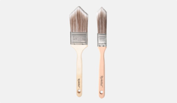 Two paint brushes with thick bristles. 