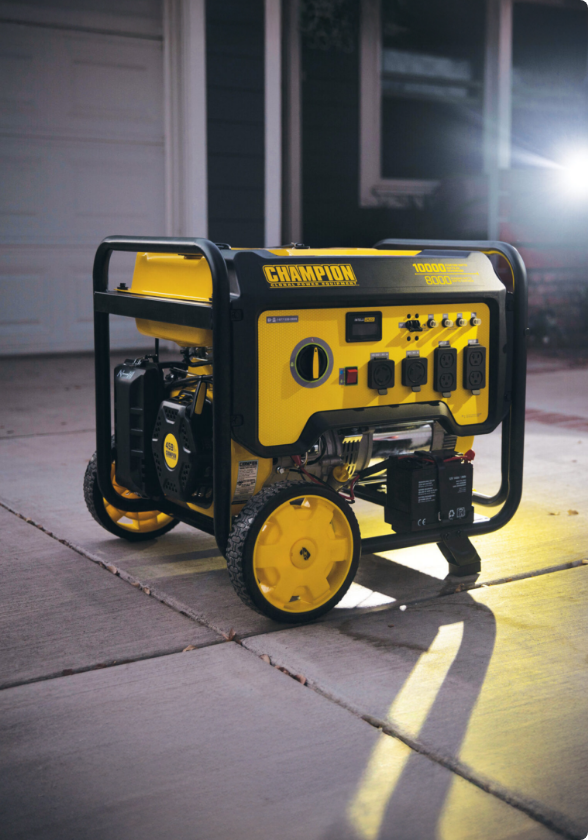 A generator on a driveway with a flashlight glow coming from behind.