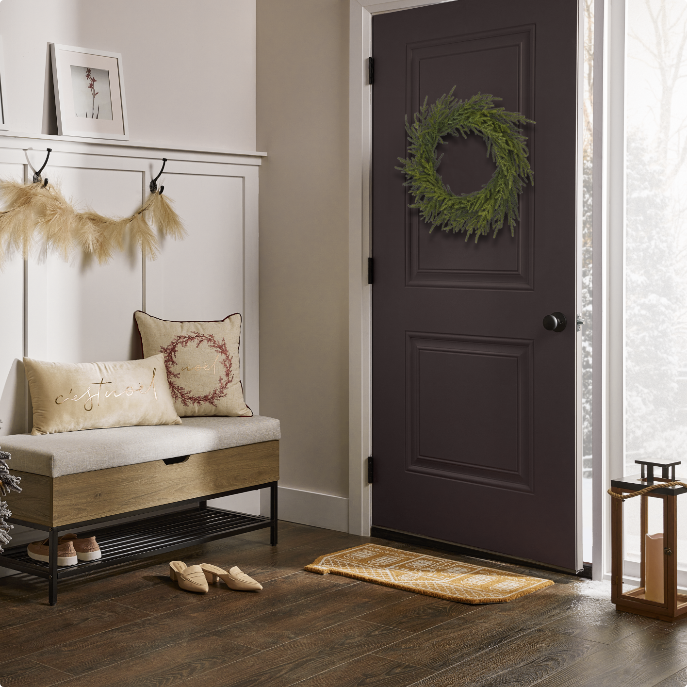 An indoor entryway with a CANVAS wreath, pampas garland and a Coir mat.