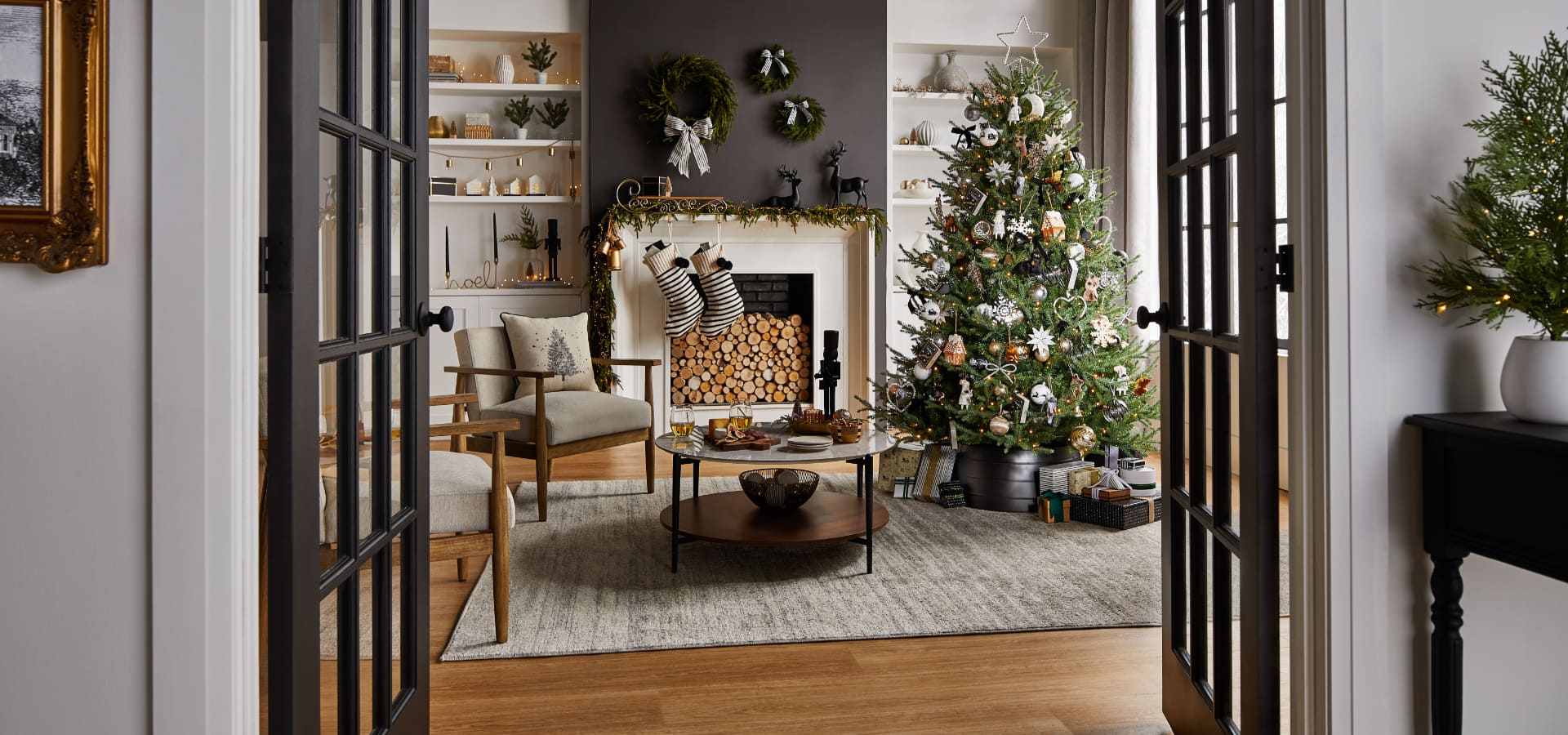 A living room decorated with CANVAS Night Before Christmas decorations. 