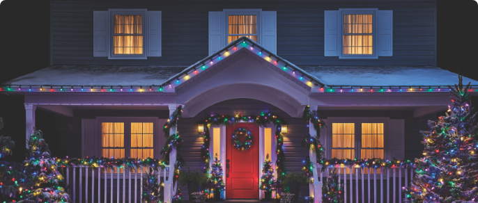 The exterior of a home decorated with NOMA Christmas lights. 