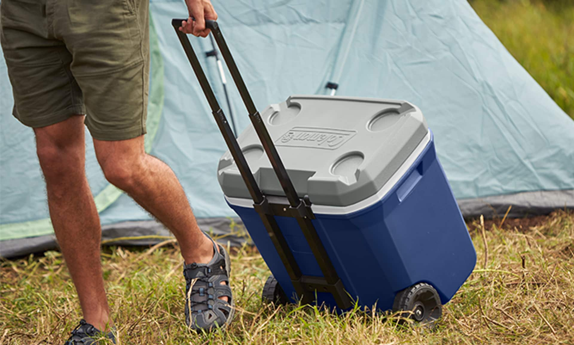 Answer the call with the Coleman 316 Series 65-Quart Wheeled Cooler