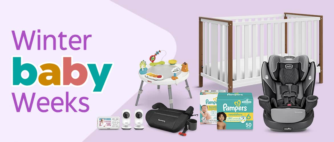 A crib, two boxes of Pampers diapers, an activity center, a car seat and a baby monitoring system.