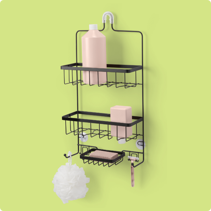 A wall-mounted shower caddy holding shampoo bottles, soap and a loofah.