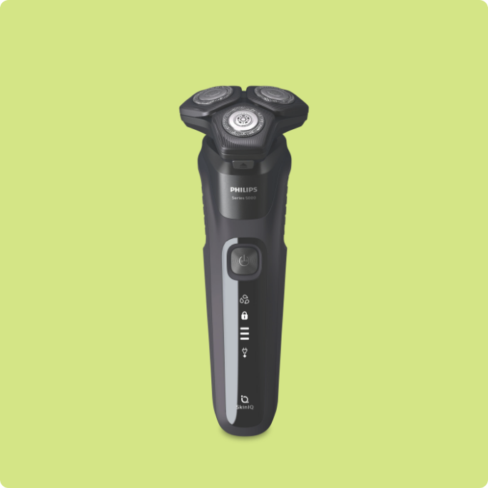 A black Philips electric shaver.