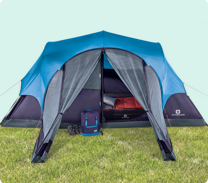 A blue and gray camping tent set up on grass.