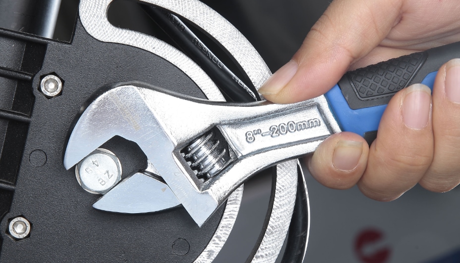 An adjustable wrench in use.