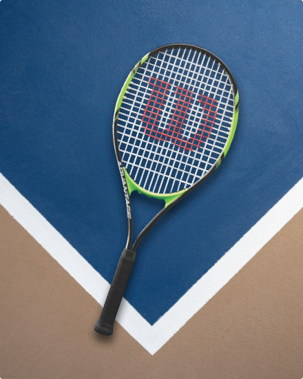 A tennis racquet on a court.
