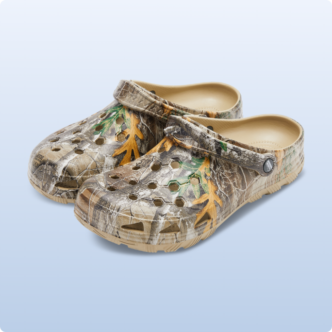A pair of camo-patterned slip-on shoes.