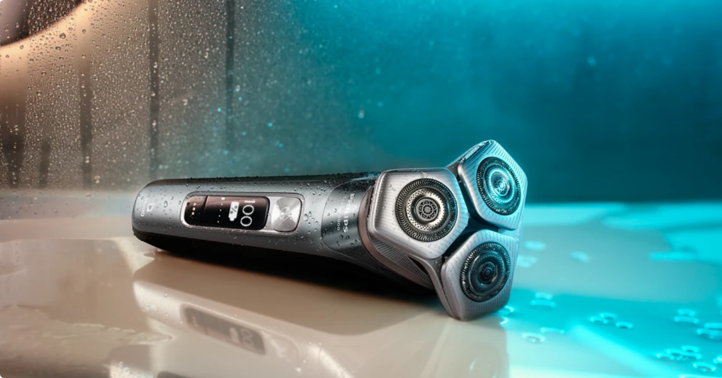 An electric shaver on a wet surface.