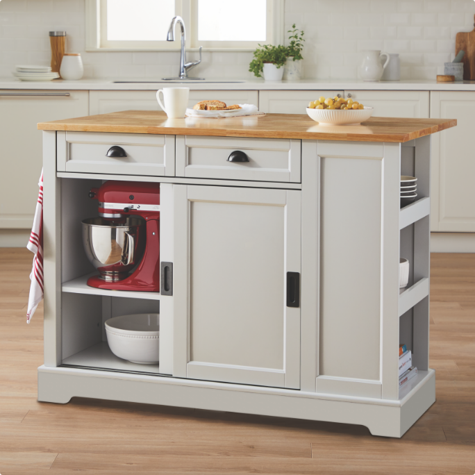 A kitchen island cart with a wooden countertop and open shelves for kitchen appliances.