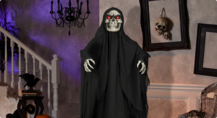 An animated skeleton reaper Halloween decoration in a spooky indoor setup.