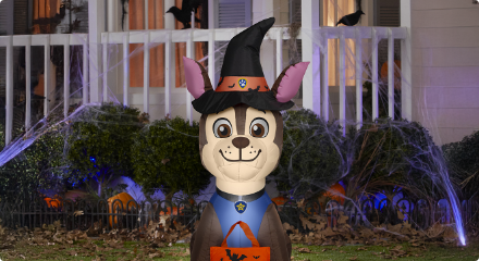 A Paw Patrol inflatable Halloween decoration featuring a dog dressed as a witch.