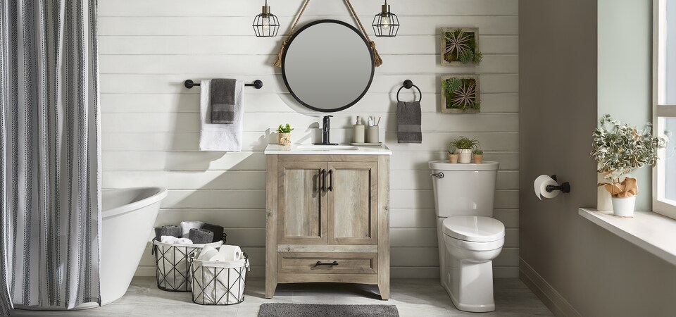A beautifully done up bathroom with a neutral wooden vanity. 