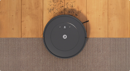 Robot vacuum on a hardwood floor.