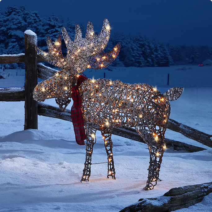 A moose decoration adorned with twinkling lights.