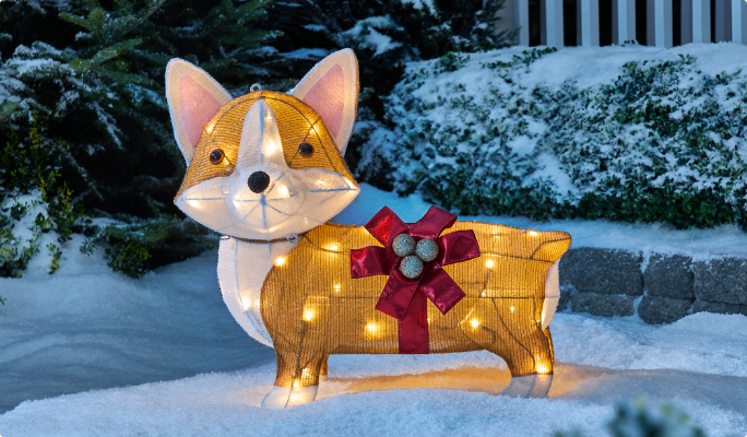 A range of CANVAS Whimsical pre-lit wireform figures on a snowy lawn