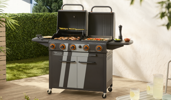 A MASTER Chef® Grill Turismo Grill & Griddle cooking food on a patio.